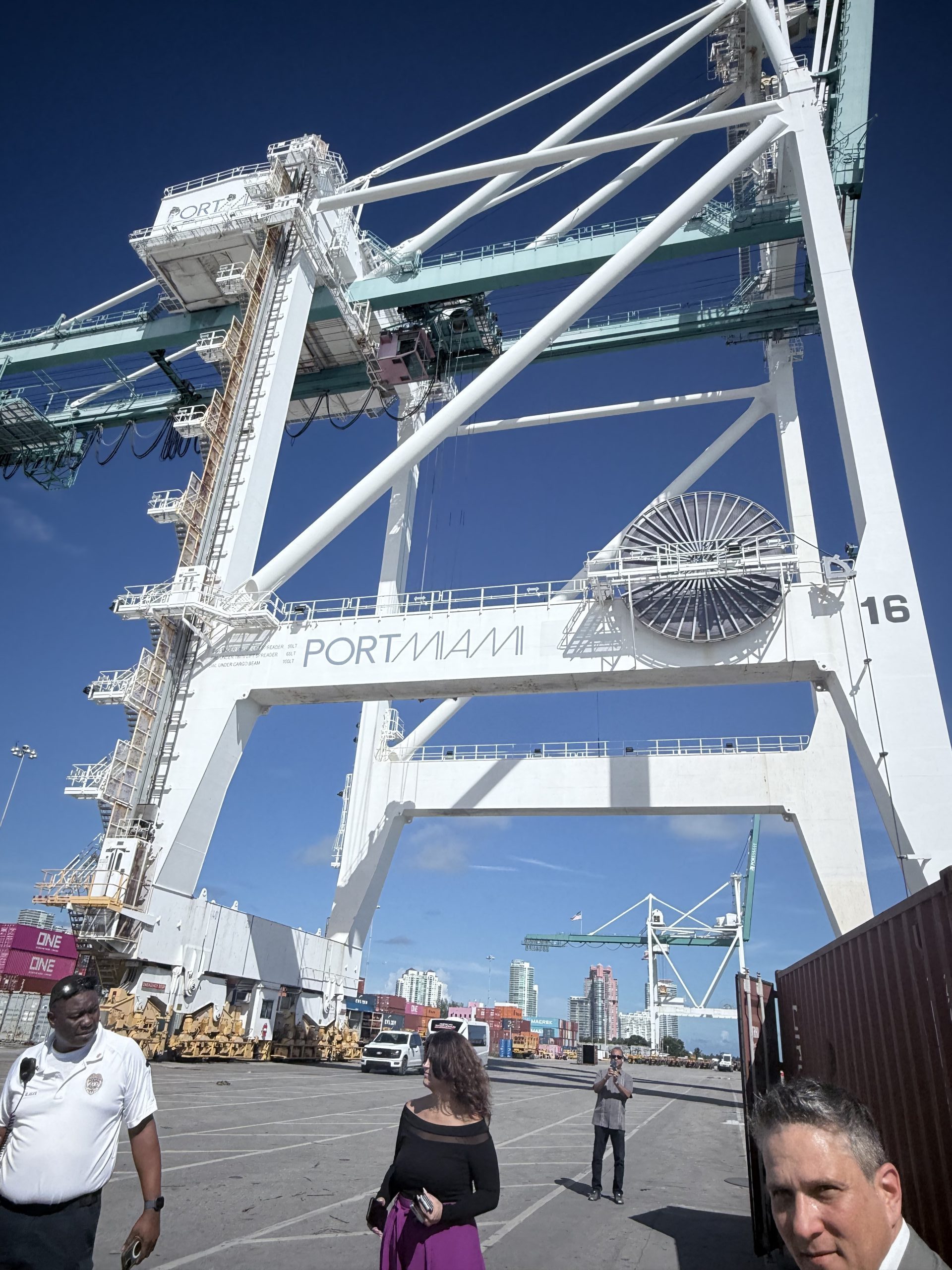 A detailed view of heavy-duty cranes and port machinery in operation, essential for unloading and loading shipping containers at PortMiami.