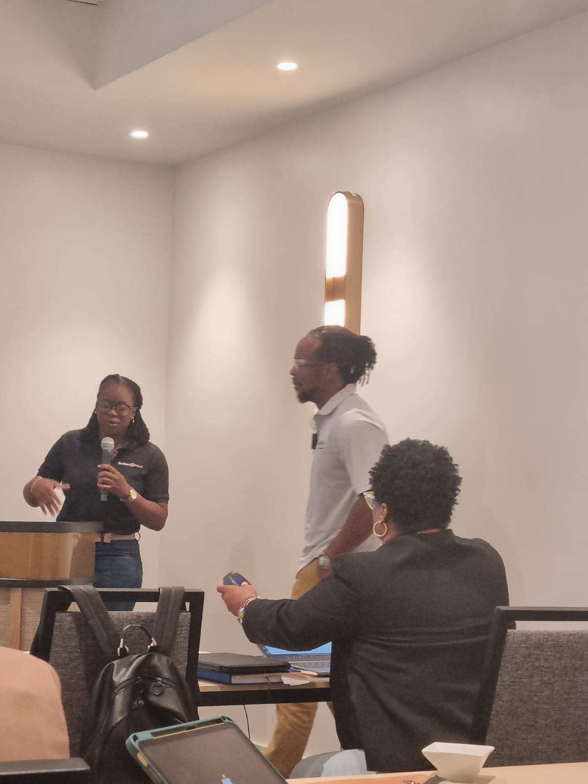 A participant asks a question during a CACUB 2025 breakout session, fostering active dialogue and knowledge sharing among customs professionals.
